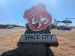 Weatherford Space City sign (red) by Southwestern Oklahoma State University