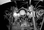 Three astronauts inside Command Module Simulator during Apollo Simulation