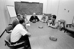 Apollo 10 and 11 crews photographed during Apollo 10 debriefing